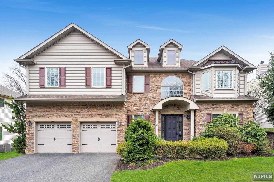 A fabulous residence with unobstructed wooded views, located in the highly sought after community of The Reserve at Bel Air. The open floor plan with high ceilings includes 4 spacious bedrooms on the 2nd level with ample space for study, sleeping, & storage. Primary en-suite bedroom with large custom fitted closets will ensure privacy. 2nd floor laundry room provides additional convenience. Wood floor & plenty of natural light flow throughout the homes open airy layout. The gourmet kitchen with center island flows seamlessly into the dining room. A large family room features a built in bar, wine rack & a double sided fireplace adjoining to the kitchen. Enjoy gatherings in the the generously sized kitchen area graced by the fireplace, large windows & 2 sliding glass doors that lead out to the new composite deck with wooded views. This immaculate home offers a finished lower level with high ceilings & full bath. Located near NYC transportation. Playground in the community.