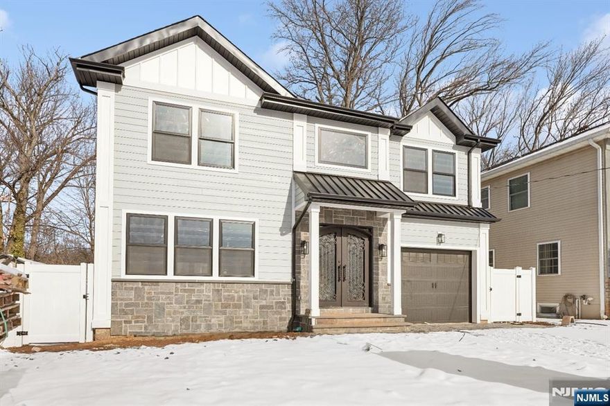 Beautiful new construction home in Bergenfield. Grand entrance way with double height ceilings. Open concept living room and dining room that flow into the family room which has a gas fireplace. Modern kitchen with two sinks, two dishwashers, three ovens, pot filler, warming drawer, microwave and wine fridge. A large walk in pantry and powder room complete this floor. Upstairs you will find the primary suite with two walk in closets, four additional bedrooms, two full bathrooms and the laundry. The basement has nice sized rec room, a wet bar, two bedrooms and a full bathroom. This home is waiting for you!