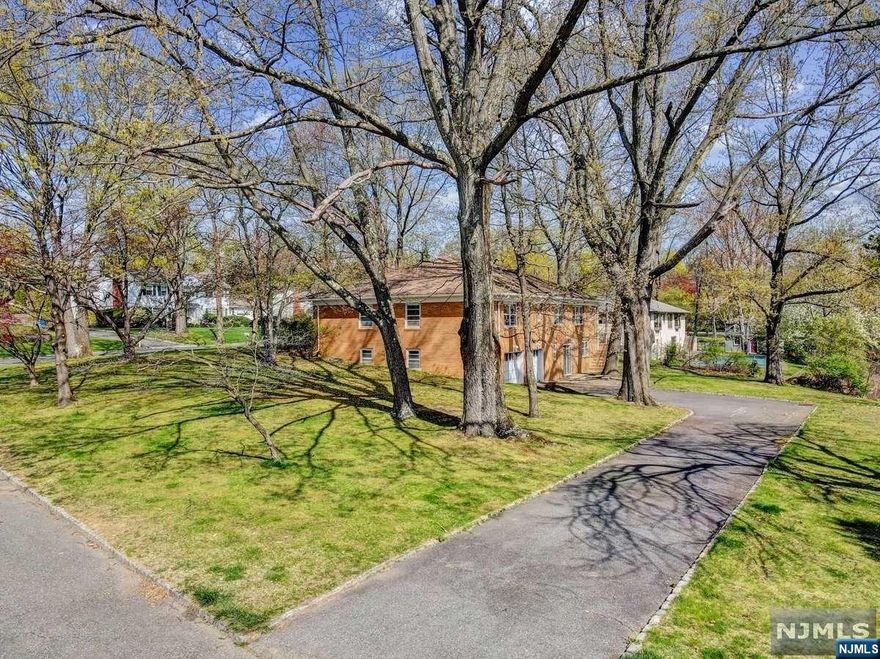 What an incredible opportunity to own in the Normandy Heights section of Morristown on the dead-end, cul-de-sac of Pond Hill Road! Situated by a tranquil pond, this absolutely enormous, all brick constructed home offers 4 bedrooms/3 full baths that include a Primary en-suite (all bedrooms will accommodate King-sized beds), E-I-K, laundry room, formal living room, formal dining room, a true walk-out basement with a wood-burning fireplace in the family room, full bathroom, huge storage room, a long, exclusive driveway with a 4-car garage! This house sits on a sweeping corner lot that will accommodate a pool, could be fenced in for pets and swing-sets, and is bursting with colorful, blooming trees. Only 3 of the 12 homes on Pond Hill Road have the pond view. Morristown is a commuter's dream and downtown has tons of shops & restaurants ** OPEN HOUSE on Mother's Day, May 14th has been CANCELLED **