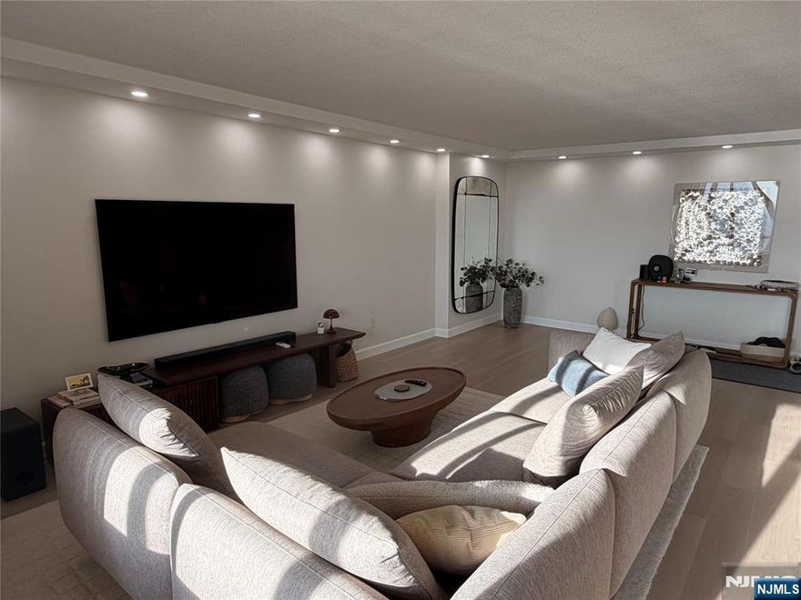 This beautifully updated 2-bedroom, 2-bath residence offers completely unobstructed panoramic views of the NYC skyline, sweeping across New Jersey, and stunning sunsets. This immaculate home features a newly renovated kitchen and bathrooms, along with updated flooring throughout. Located in the sought-after Winston Towers, it provides effortless access to NYC via NJ Transit buses or the NY Waterway Ferry, with a convenient shuttle stopping right in front during rush hours. Residents enjoy an array of premium amenities including 24-hour doorman and security, an outdoor pool with kiddie pool, tennis courts, playground, indoor playroom, card room, and a rooftop party room. Parking is available for $133 per month, which includes two spaces ($75 for the first car and $58 for the second)