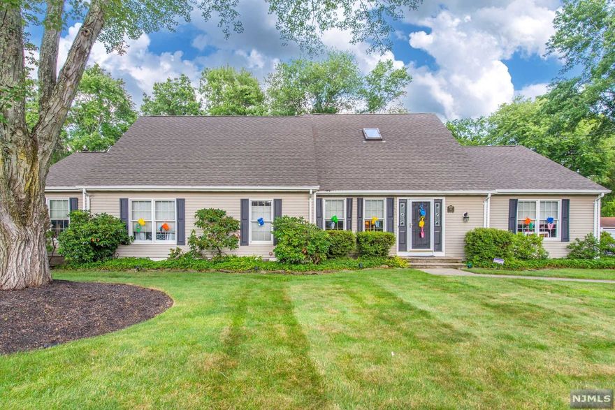 Looking for a beautiful and spacious home with extra living space? Look no further! This amazing home, inside and out, has wonderful curb appeal for all to admire. Main home features updated Kitchen with Silestone counters and stainless steel appliances, large Living Room, formal Dining Room, Family Room with wood burning fireplace and Powder Room on 1st floor. The 2nd floor features: Master Bedroom with 2 additional Bedrooms, 2 full baths, Office and Laundry Room. Separate living quarters includes: Eat-In-Kitchen, Living Room, 2 Bedrooms, full bath, entrance into the screen room and separate driveway. Screen Room off the back of the house, along with the beautifully landscaped and fenced yard, deck, heated in-ground pool, over-sized garages & driveway is perfect for all to enjoy! Must see!