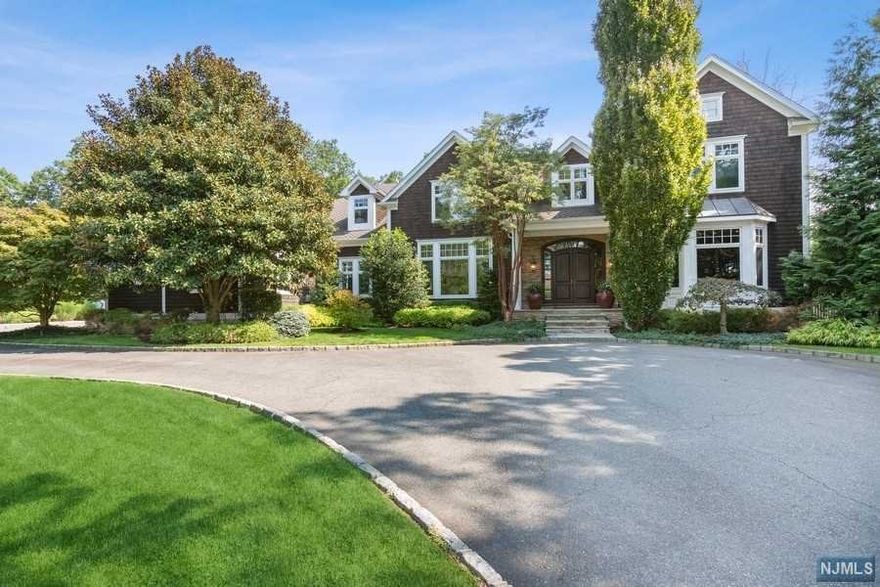 A one-of-a-kind custom estate awaits you in the prestigious Coventry section of Livingston. This elegant Colonial is built for entertaining and is situated on over 1 acre of magnificent grounds. The dramatic 2 story entry foyer with a sweeping staircase welcomes you into the home. Quality abounds with a recently updated chef's kitchen. Working from home will never be the same once you enter the stunning first-floor office, which includes exceptional millwork and is complimented by a wet bar and billiards room. The attention to detail is undeniable, from the oversized family room with coffered ceilings to the stunning dining room. Enjoy the luxurious primary suite, which includes a spa-like bathroom. Upon descending to the lower level, you are welcomed into a themed 12 television sports bar, a game room, and an entertainment area. In addition, there is a spectacularly appointed gym and sauna. This home takes relaxation and enjoyment to new heights!