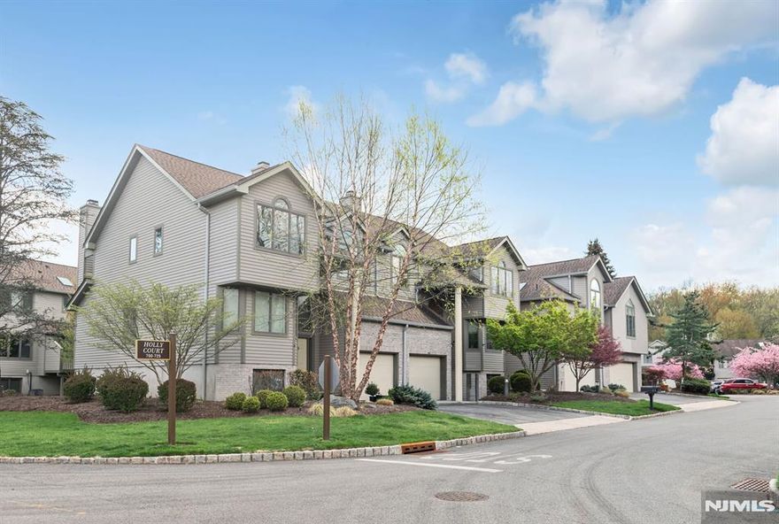 Meticulously maintained and tastefully updated gorgeous townhouse is now a turn-key opportunity for families, professionals or downsizers seeking quality, comfort and convenience. Future proofed for ease of living with many updates, ample storage and adaptable spaces to suit the changing needs. Enter the 2 story entrance foyer, that opens to both the huge Family Room and Formal Living Room, and feel a sense of bright, airy living. Lower level w/ abundant natural lighting is open to the FEF and offers a huge, family or rec room, storage including a walk in cedar closet, bedroom, full bath & utilities (updated). The bright (large windows and 2 sliding glass doors to the deck) 1st floor welcomes you with an oversized FLR w/ fireplace & FDR, along with closet, powder room and MEIK w/ lovely breakfast dining area. 2nd floor features a large landing open to the floor below & 2 suites, including a junior suite w/ full bath and a large primary suite with 2 walk in closets, linen closet & an updated, gorgeous primary full bath w/ separate soaking, claw foot tub and walk in shower along w/ radiant heat. Ceiling fans, multiple zone heat and central AC and central vacuum, add to the comfort and appeal for any new owner. Northwoods is a highly desirable development with full amenities in a stunning, natural setting. All units have new roofs and siding along with new pavement on all the courts.
