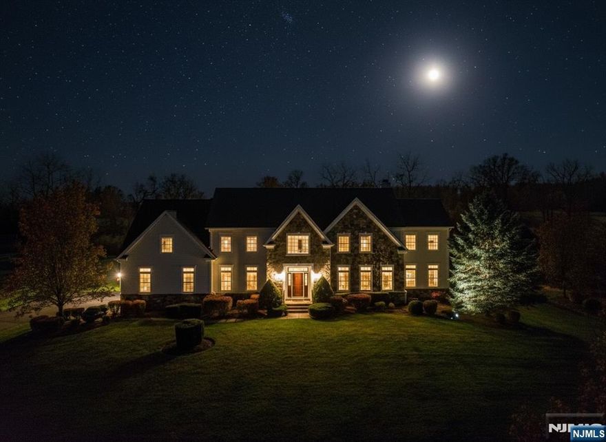 This impressive, 5,300+ sf colonial is timeless elegance, generous living spaces, and high-end finishes throughout. From the moment you enter the grand two-story foyer-its sweeping curved staircase-youâ€™ll feel the sophistication and comfort this home provides. The main level features gleaming hardwd flrs & abundant natural light, a beautiful conservatory surrounded by oversized windows & transoms that frame the outdoors. The gourmet kitchen is a chefâ€™s dream, outfitted w/premium Wolf appliances, including a double wall oven, 6 burner gas cooktop, & professional-grade hood. Ample counter space and thoughtful layout make it the heart of the home. Upstairs, youâ€™ll find 5 spacious bedrooms. The primary suite is a luxurious retreat, with private sitting room and a see-thru FPlace shared between the 2 spaces. The suite is a quiet sanctuary ideal for unwinding at the end of the day. 2 additional BRS suites feature convenient Jack-and-Jill designsâ€”one with its own game roomâ€”and each includes its own dedicated bathroom. A 2nd staircase has direct access from the laundry to 5th bedrm, adding functionality & privacy. The home also includes a large, unfinished basement w/endless possibilities, as well as a 3 car garage providing ample storage and convenience. Multiple sets of sliding doorsâ€”3 in totalâ€”open to the backyard, making outdoor access seamless & inviting. This exceptional home blends luxury, comfort, & thoughtful design in one of the areaâ€™s most desirable setting