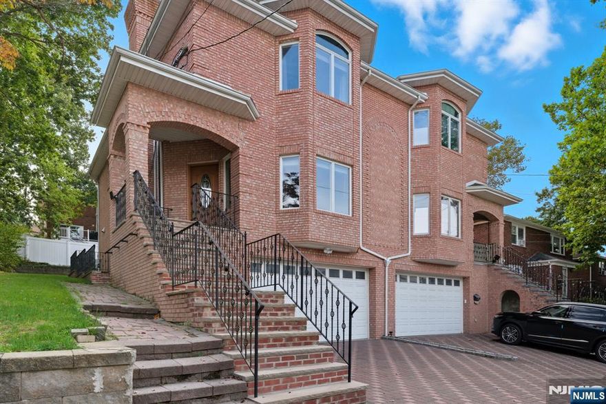 Oversized with luxury feel...this duplex home boasts gleaming hardwood floors throughout with wonderful mill work and accents. Main floor features spacious open layout of large living room w/bay window and fireplace, dining area, gourmet kitchen with island and brkfst area w/sgd to patio, PR, and Lndry. 2nd offers a luxury prim bedrm w/ prim bathrm, 2 nice size bedrms, and full bath. Basement with access to 2-car gar, finished room w/ full bth and seperate entrance. All the comforts of home with a luxurious twist. Great location. Come and See!