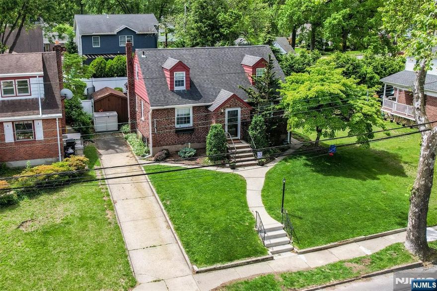 Welcome home to this beautifully maintained and move-in condition Cape. Located on a quiet street just blocks to NYC train & bus. Many updates over the years including beautiful Granite Kitchen in 2015 plus making an exit to the rear yard via SGD. Ductless C/A added in 2023 & new water heater 2022. Home offers a wonder I/G pool for summer fun with a new liner in 2021 and safety fence 2025. Other features include beautiful hardwood floors in most rooms, finished basement with gym & rec area and the large 2nd floor primary suite with private bath. Call Leta for private showing at 201-446-3566