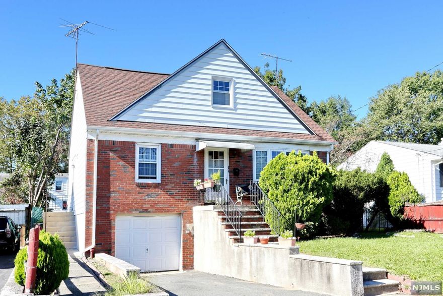 Large cape in the Hillcrest section of Paterson. All large rooms. First Fl Two bedrooms, Eat in Kitchen bath and living room. Second Fl Large Family room or Bedroom with small Den , Bedroom and Bath, Skylight. Basement semi finished. Near elementary school. Plenty of street parking. Attached Garaged