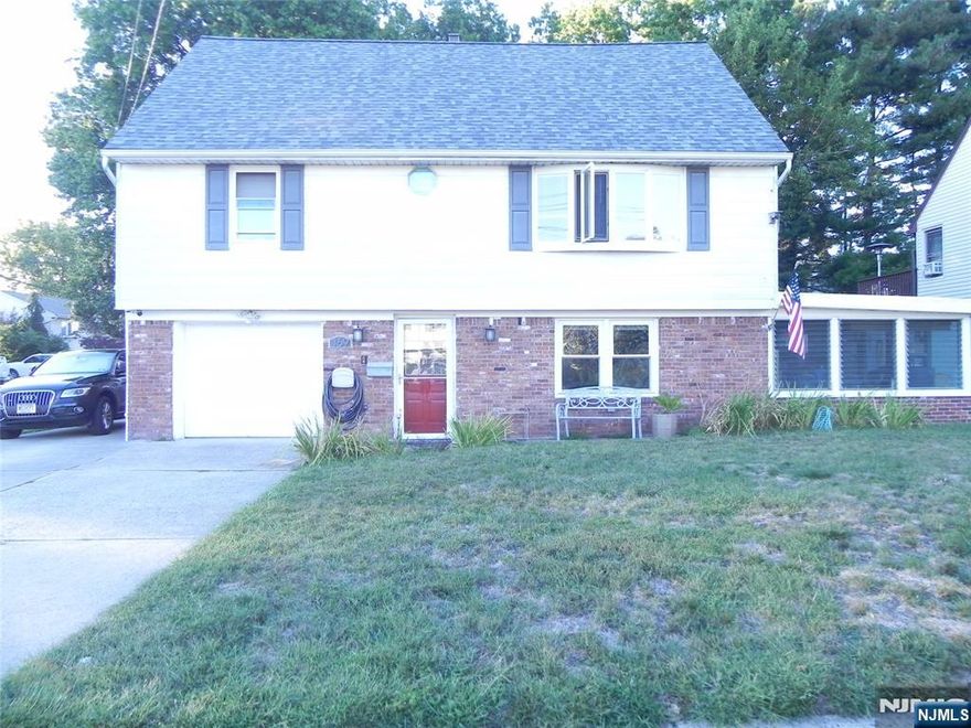 THIS HOME FEATURES ON THE GROUND FLOOR A FAMILY ROOM WITH A BAR SET UP, LARGE SUNROOM WITH ENTRANCE TO THE BACKYARD, LAUNDRY, UTILITIES, H/BATH AND ENTRANCE TO THE GARAGE AND BACKYARD. THE 1st FLOOR FEATURES A NICE SIZE LIVING ROOM/DINING AREA, KITCHEN, 2 BEDROOMS, FULL BATH AND ENTRANCE TO THE DECK AND BACKYARD. THE 2nd FLOOR FEATURES 2 SPACIOUS BEDROOM AND ANOTHER FULL BATH. OTHER FEATURES OF THE HOME ARE PARKING FOR 5 CARS, ROOF 8 YEARS OLD, WINDOWS 8 YEARS OLD, HARDWOOD FLOORS, HUGE BACKYARD, CLOSE TO PARKS, SHOPPING, NYC TRANSPORTATION AND MORE.......More Pictures Coming Soon.....