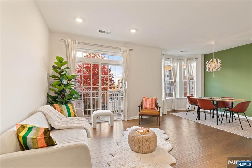 Dream home alert in one of Bergen County's top-rated town! This stunning townhome boasts high-end upgrades throughout, a gleaming backsplash and abundant natural sunlight creates a warm, inviting atmosphere. Open concept living and dining with bay windows, walk-out balcony, hardwood floors and stainless steel appliances. Grand master suite features a spacious walk-in closet and a spa-like bathroom, perfect for unwinding after a long day. A bright studio/den filled with natural light adds versatile living space to complete this exceptional home. Enjoy unparalleled convenience with NJ Transit steps away and direct bus service to the city, making your commute effortless. Plus, the proximity to the American Dream Mall that offers entertainment, shopping, and dining options just minutes from your door. This townhome combines luxury and convenience. 1,771 sqft layout features 2 bed, a bonus room and 2.5 bath. Lifestyle benefit with Community living that you wouldn't want to miss. *Easy Move In *30 Mins to NYC and On site train station *Direct bus to city blocks away *Multiple kids playground, soccer field, dog park *Grocery and restaurants few blocks away