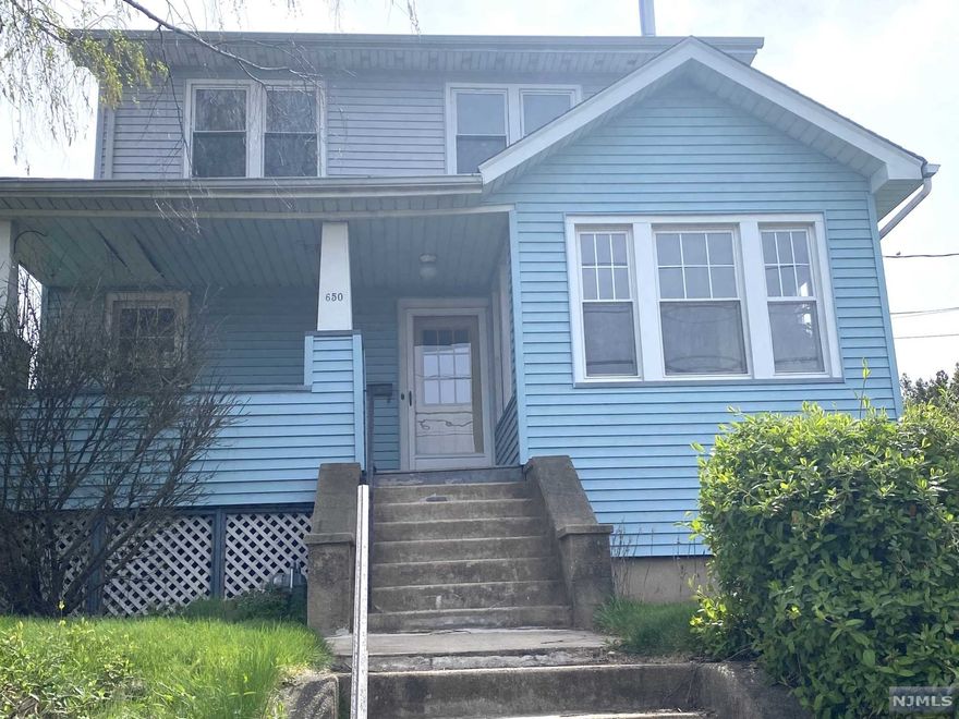 Situated on oversized 86 x 120 corner lot - This 2 family offers 2 spacious apartments, each with 3 bedrooms, hardwood floors, gas heat, separate entrances, extra large basement, and a one car detached garage. Needs work but well worth the effort. Sold absolutely "as is". Buyer responsible for C.O. and any repairs. No FHA. Excellent location for the commuter - NY bus on corner!