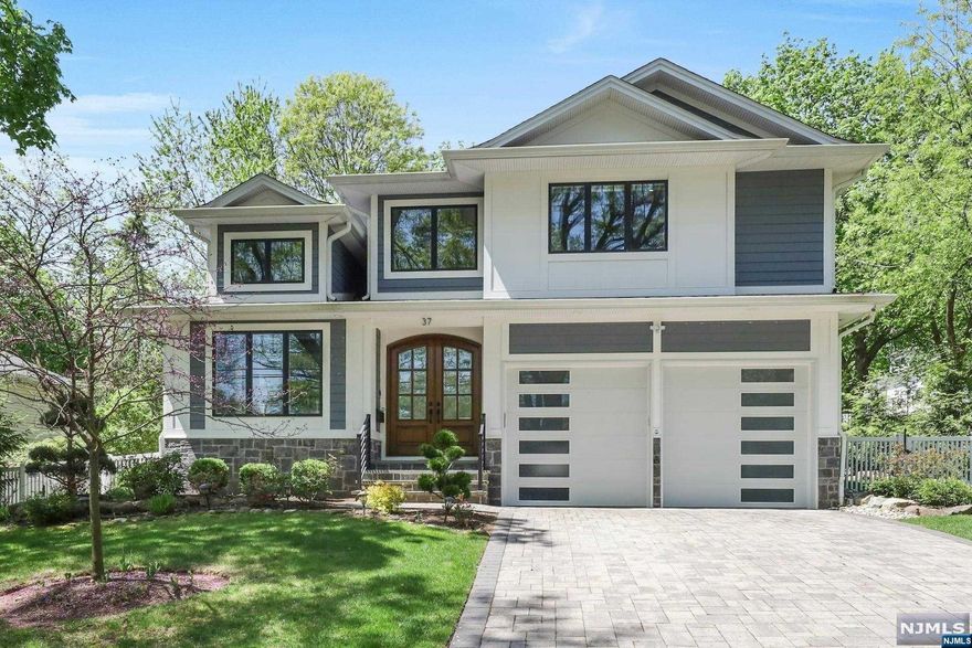 >>>Call Listing Agent Anat 201.341.4765<<< Stunning 6 yr young home, crafted by top-tier builders, awaits your personal touch. Nestled on a serene cul-de-sac., This home epitomizes luxury living. Blending elegance with functionality, it boasts an open-concept layout. The heart of the home is a chef's kitchen with premium appliances and a walk-in pantry. Expansive family room, adorned with a modern electric fireplace, flows into the dining and living areas, all graced by lofty ceilings. Chic powder room and mudroom enhance the first floor. Upstairs, discover the lavish master suite, featuring dual walk-in California Closets and a spa-like master bath. A private guest suite and two additional bedrooms, connected by a J & J bath, offer comfort and privacy. Laundry room conveniently situated on the second floor. The lower level has a bedroom, playroom, wet bar, and a fully equipped theater. Experience ultimate life style with the lavish outdoor pool,waterfalls,kitchen and fire pit