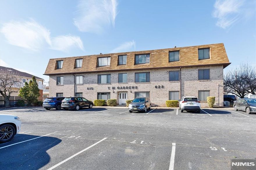 Stylish and spacious 2-bedroom, 2-bath condo in the desirable TM Gardens complex. This updated first-floor unit features a sleek modern kitchen with stainless steel appliances, quartz countertops, and custom cabinetry, flowing into a bright open-concept living and dining space. The primary suite offers a beautifully renovated en-suite bath and a large walk-in closet with custom organizers. Additional highlights include central air, in-building laundry, and two parking spaces.