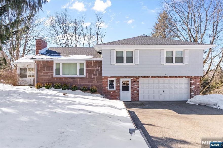 Located in the prestigious East Hill of Upper Saddle River, this spacious and sun-filled expanded 5-bedroom split-level home offers an incredible blend of comfort, elegance, and functionality. Featuring hardwood floors, skylights throughout, and a bright living room with a fireplace, this home is designed for both relaxation and entertaining. The large kitchen boasts skylight over the eating area, with picturesque views of the multi-level backyard decks and in-ground pool, creating a true private retreat. A lovely sunroom and multiple sliding doors seamlessly connect indoor and outdoor spaces, perfect for gatherings. The grade-level family room, along with an additional bedroom and full bath makes an ideal space for extended family or guests. Enjoy central air, oversized bedrooms and a bonus room perfect for a gym. With a two-car garage and a driveway that fits six cars. This town known for its top-rated schools and serene lifestyle Highest & Best Tuesday 02/25 - 12:00pm