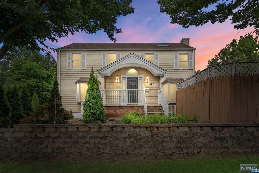 True Pride in Ownership! Impressive Center-Hall Colonial in the heart of Paramus has everything you need plus more! Enter into a large entry foyer w/vaulted ceilings! Natural light pours into the Living & Dining Rooms through the Bay Windows w/seating. Every detail from the Crown moldings, Wainscoting, Recessed lighting & Refinished hardwood floors create an aura of elegance. Galley style EIK with breakfast bar overlooks the sunken den. This room is the perfect getaway offering a gas fireplace & french doors leading to the paver patio & deck. The rest of the 1st level boasts a bedroom(office) & Completely Remodeled bathroom w/shower stall. The top level offers a sun drenched Primary Room with en-suite bath & 2 skylights. The rest of the 2nd Fl consists of 2 large bedrooms.The partially finished basement with recreation room flows into the large 1 car garage. Energy efficient 2 zone Central AC/Heat. Take advantage of the low taxes & amenities Paramus has to offer!