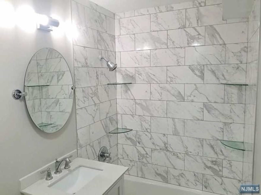 Commuters Delight! Come see this Beautiful 3 Bedroom 1 Bathroom house with a Gorgeous Kitchen. Close to NY Transportation, Highways (3, 46, 80, GS Parkway), Parks, and shops. The basement is framed, with tiled floors, and is heated with it's own thermostat. Washer and Dryer are included.