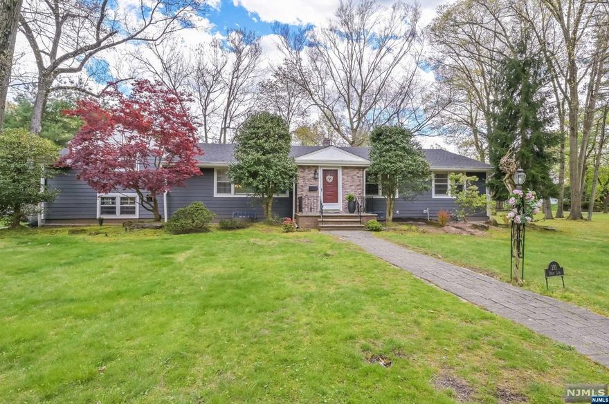 This custom designed ranch has been meticulously updated. Nestled on .73 acres of lush greenery, visitors will admire the newly restored front entrance and professionally landscaped facade. Enter to a formal living room with a large open space perfect for anything from your grand piano to seating twenty or more at your next holiday party. Enjoy the gracious, open concept kitchen and dining room, flooded with natural light from the skylight. Adjacent to the dining room is the home's crowning jewel, a family room with a 15 foot ceiling boasting wrap around windows and skylights. All four bedrooms are generously sized, two with ensuite full baths. The supersized bedroom can easily be used as an office, gym, or another family room. The house features an oversized, attached two car garage with a side entrance to a tidy mudroom. Within a short walk to the Terrace Street cafes and shops along with tennis and pickleball courts. Haworth School, parks plus the beautiful Haworth Pond!