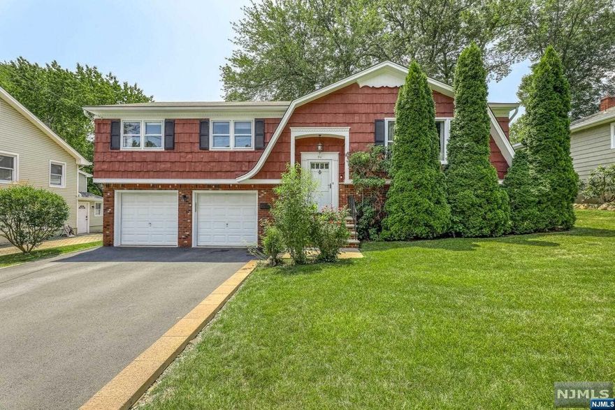 Meticulously maintained Bi-Level style home on a lovely side street yet close to schools, shopping and transportation in desirable Waldwick with town pool and excellent schools. First floor features a light and bright living room with picture window and recessed lights which opens to formal dining room and kitchen with granite, new stove and refrigerator. Primary bedroom has new carpet with hardwood beneath and full bath with new sink and toilet. Two more bedrooms and a full bath complete this level. Enjoy a ground level with new wide plank vinyl luxury flooring in the spacious recreation room with wood burning fireplace and sliders leading to a patio accented with stone retaining wall. A large 4th bedroom, powder room and laundry complete this level. Property has curbside appeal and is so well kept. Amenities include: two car garage w/shelving, central air (2 years young) and whole house filtration system.