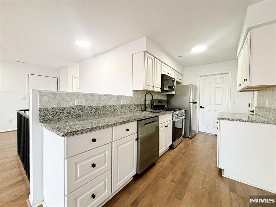 Beautifully detailed & renovated LARGE END UNIT with 1820 SQFT and EASY ACCESS (only three steps). Featuring 3 bdrms, 2 baths, and a massive recreation room, this spacious unit is the epitome of comfort. All new Stainless Steel Appliances, Lighting, Kitchen, Fixtures and more. First floor features open-floor concept Living & Dining Area with abundant natural light and sliding glass doors that lead to a wraparound deck, kitchen, 2 bdrms, full bath, and laundry. Ground floor features an oversized primary bedroom with access to another private deck, full bath, and a huge recreation/family room with endless potential to tailor the space to your needs! Enjoy this 4-Season Community, HOA Pool, Minerals Resort & Spa, Mountain Creek Skiing and Waterpark. Bars, restaurants, nightlife, golf, mountain biking, shopping, day spas and many year-round festivals. Only 50 miles to NYC! Perfect for year-round living, investment opportunities, AirBNB, or an ultimate vacation getaway! Must See!!