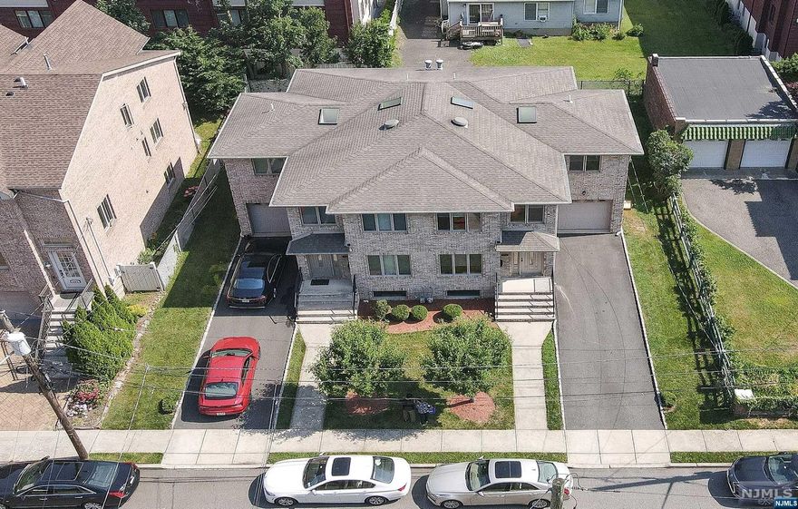 Over-sized two family house (side by side) built in 75x100 land at prime location of Fort Lee. Each unit is identical structure with 4 bedrooms/2 full bath/2 half bath/Finished basement with Ground level access & large window. 2 Sky lights/patios/wide stairs. The current owner built this house in 2004 & attentively maintained. This 2 family will be sold as whole not separately & Sold "As-is condition". No lockbox, Listing Agent will be accompanied for all showings.