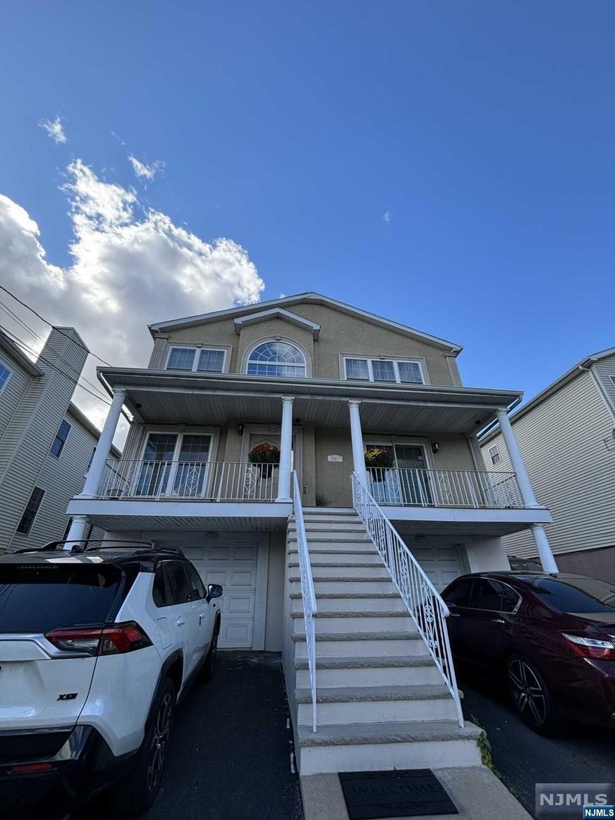 Beautiful large 2 family house in Lakeview Section of Paterson. Each floor features 6 rooms. 3 bedrooms, living room, dining room, eat in kitchen and 2 full baths. All hardwood floors. 1st floor has a gas fireplace. Finished basement with laundry room and half a bath. 2 car garage. Home built approximately 2004. Close to all major highways, public transportation, restaurants. HOME BEING SOLD IN AS-IS CONDITION.