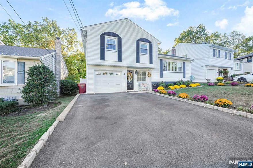 Welcome to this charming 3-bedroom, 1.5-bath split-level home perfectly situated on a quiet, tree-lined street in one of Nutleyâ€™s most desirable neighborhoods. This well-maintained property offers a seamless blend of comfort, functionality, and small-town charmâ€”ideal for todayâ€™s modern lifestyle. Step inside to find a bright and spacious living room with large bay windows that fill the home with natural light. The open dining area flows into an updated kitchen featuring stainless steel appliances, granite countertops, and plenty of cabinet spaceâ€”perfect for everyday meals or entertaining guests. Upstairs, youâ€™ll find three generously sized bedrooms with ample closet space and a full bath tastefully updated with modern finishes. The lower level offers a cozy family room or home office, a half bath, and convenient walk-out access to the backyard. Outside, enjoy your private yardâ€”ideal for summer BBQs, relaxing weekends, or gardening. The attached garage and driveway provide plenty of parking and storage. Located just minutes from Nutleyâ€™s top-rated schools, parks, downtown shops, and NYC transportation, this home combines suburban tranquility with unbeatable convenience.