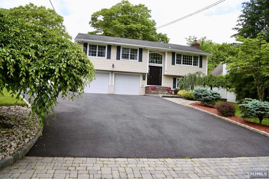 Gorgeous, Updated home with upgrades galore!! Kitchen/Granite ctr, stainless appliances, custom cabinetry, under cabinet lighting, vaulted ceiling, updated bathrooms-main bath all marble floor to ceiling, master bath also with marble floor, custom molding throughout. First floor-living room, formal dining room, kitchen, 3 bedrooms, main bath-master bedroom/full bathroom. Lower level -family room /fireplace, bedroom, full bathroom, laundry room, access to 2 car heated garage and access to yard from hallway. Other updates include all hardwood floors, ceramic tile floors, recessed lighting, Marvin windows and so much more!Great fenced in yard with paver patio. It doesn't get any better...unpack, move in and enjoy!!