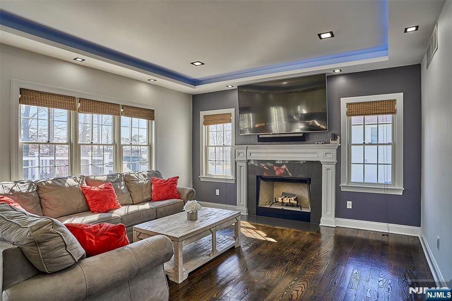 Recently built and move-in ready, this home blends clean design with everyday comfort in a well-established West Orange neighborhood. Sun-filled open layout with hardwood floors, a spacious living room with fireplace, and a sleek kitchen featuring custom cabinetry, stainless steel appliances, and a center island that anchors the space. The fully finished basement is the true standout complete with a den, full bathroom, and flexible layout ideal for a private guest suite, home office, or entertainment retreat. The baby grand piano is included, adding a rare and memorable touch. Step outside to a private backyard with a large deck, outdoor kitchen setup, and sprinkler system built for effortless entertaining whenever you want. Includes a two-car garage and a bonus attic for additional storage. Outfitted with solar panels, a full security system, whole-home Sonos sound, and customizable LED recessed lighting with color-changing ambient settings. Conveniently located near Route 280 and the Garden State Parkway for easy NYC access, and just minutes from Eagle Rock Reservation, South Mountain Reservation, Turtle Back Zoo, and local shopping and dining.
