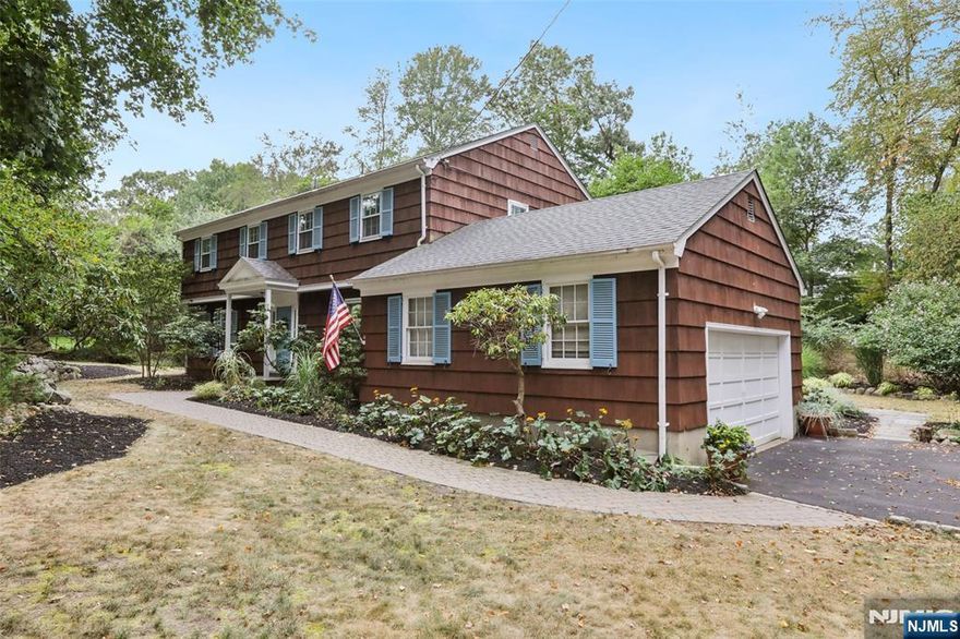 Welcome to 684 High Mountain Road, a charming center hall colonial situated on the desirable South Gate Urban Farms. This specious 4-bedroom,2.5-bath Colonial on 1 acre offers front to back living room, dining room, eating kitchen, family room with a fireplace and large windows overlooking a very private backyard. Second floor offers primary bedroom suite and three additional bedrooms and full bathroom. Perfect home for entertaining and everyday life.Finished basement, hardwood floors throughout, C/A. Located just steps from schools, houses of worship,Market Basket shopping center and Indian Trail Club.