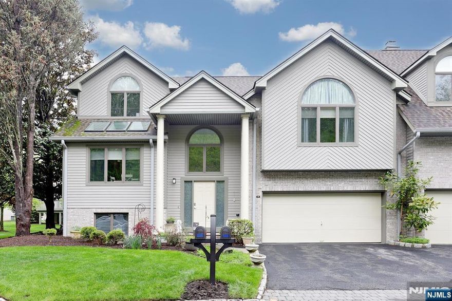 Prepare to be IMPRESSED by this RARE opportunity in highly sought-after Northwoods. This expansive and updated END UNIT townhouse offers over 3,700 sq ft of beautifully designed living space, beginning with an impressive two-story foyer that sets the tone for the entire home. The gourmet kitchen features maple cabinetry, granite countertops, stainless steel appliances, and a center island with a spacious dining areaâ€”perfect for everyday living and entertaining. The open floor plan flows seamlessly into the elegant dining room and the DRAMATIC Great Room, complete with soaring ceilings, skylights, gas fireplace, and sliding glass doors leading to the deck. The primary suite enjoys its own level, showcasing a cathedral ceiling, a LAVISH spa-like bath with double vanity and oversized LUXURY shower, plus a walk-in closet and an additional closet for exceptional storage. Two additional bedrooms on the upper level offer abundant closet space. The lower level adds even more versatility with a large family room, 4th bedroom/bath suite...perfect for guests, and a laundry/utility room. A full history of upgrades is available. *Tesla charger in garage.* This home must be experienced in person to be fully appreciated! You will LOVE living in this HOME!!!