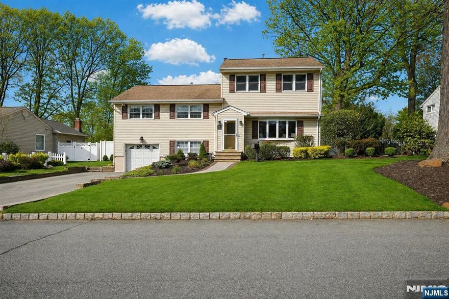 Welcome to one of the most expansive split-level homes on one of Cedar Grove's most sought-after streets where space, comfort, and everyday living come together beautifully. With approx. 2,829 sq ft, 4 spacious bedrooms, and 3 full baths, this home offers room to spread out, gather, and truly enjoy. The bright living room welcomes you with natural light, while the open kitchen and dining area create the perfect heart of the home for everything from weeknight dinners to holiday celebrations. Just beyond, the cozy den with a gas fireplace invites quiet conversations and warm evenings in. Step down into the show-stopping family room with soaring vaulted ceilings, oversized windows, and sliders that bring the backyard views inside. Whether it's movie nights, game days, or hosting a crowd, this is the space everyone will love. Upstairs, 3 generous bedrooms and a full bath offer flexibility, while the private third-floor primary suite feels like its own retreat complete with a full bath, dressing area, and walk-in closet. The lower level adds even more possibilities with a laundry room, garage access, storage, and a versatile bonus space for a gym, office, or playroom. With a privacy fence, shed, generator hookup, California closets, and more, this is a home designed for living well. Cedar Grove offers low taxes, strong community spirit, parks, shopping, and easy NYC transportation access- making this truly a dream home in a dream location!