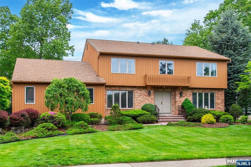 Prime location, impressive floor plan and beautiful property all located in desirable Oak Hill Estates- Welcome Home! Features include: Inviting large foyer with open floor plan, formal living and dining rooms, large kitchen with center island and adjoining breakfast room. Impressive layout for entertaining with a beautiful great room with cathedral ceilings, skylights, lots of windows, brick fireplace and sliding glass door to 3 season room. First floor has the 5th bedroom, powder room and laundry room with brand new washer and dryer (4/25). Second floor has all large bedrooms with new carpet. The primary suite: huge private room, walk-in closet and full bathroom. Additional home attributes: Multiple skylights with tons of natural lighting throughout home, recessed lights, new carpet and flooring in 5th bedroom 5/25, oversized driveway for parking, 2 car garage, whole house generator, full basement with opportunity and tons of storage. Manicured level yard with deck and 3 season room for all your outdoor enjoyment with your friends or a quiet night at home. Great location. Top rated school system, wonderful town activities. Minutes to major highways, restaurants, shopping, Whole Foods, Trader Joe's, township library and NJ Transit Bus and Train Center.