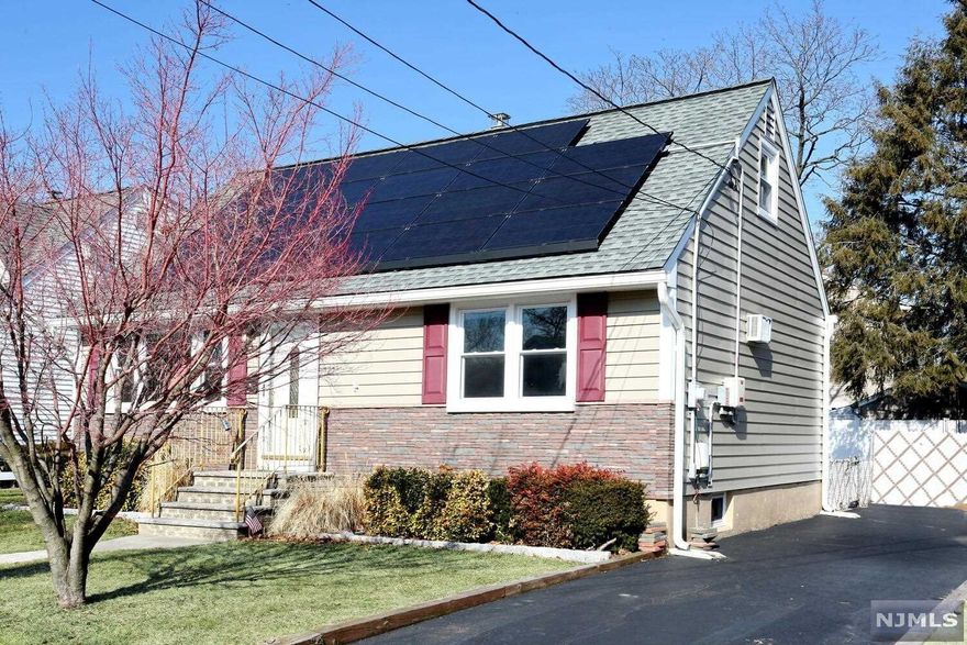 Well maintained expanded cape cod on quiet street, w/fenced in yard, paver patio, 50 x 100 property, 3 car, freshly black-topped driveway, leased roof-top solar panels - 18 yrs left on solar contract. Last 12 months electric bill averaged $16.16, Plus cost of solar panel lease of $109.42 per month. 5 yr old vinyl siding, house features 4 br's, 1 updated bath, full-size, semi-finished basement with family room & bar, storage, laundry and utilities. First floor back room used as an office can be 5th br, built in a/c, gas h/w, bb heat....won't last! https://www.sunnova.com/faq/selling-my-home-with-a-sunnova-home-solar-system