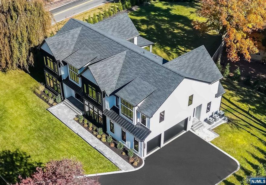 Welcome to this stunning 5-bedroom, 6.5-bath modern transitional masterpiece, a dream home waiting just for you. Boasting nearly 5,800 sq ft of luxurious living space across two floors, plus a fully finished basement featuring a home theater, gym, bar, and recreation area, this home has everything you need for modern living and entertainment. The heart of the home is the exquisite gourmet chefs eat-in-kitchen equipped with top-of-the-line Thermador appliances, quartz countertops, and butler's pantry. This large volume living and open floor concept allows sunlight to pour through the premium DAKO windows and doors, illuminating its elegant design. Each en suite bedroom offers its own private bathroom, complete with Hansgrohe fixtures and Porcelanosa vanities. Custom walk-in closets throughout ensure ample storage while adding a touch of luxury. This home truly has it all don't miss your chance to experience it!