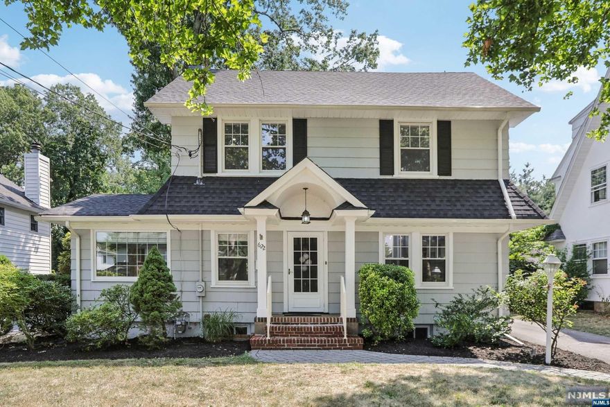 Welcome to this chic Center Colonial tucked in one of Somerville's most convenient locations, close to parks, all 3 schools & transportation! Offering an updated Kitchen with Granite counters, Stainless Steel appliances and travertine floor, a sunlit front-to-back Living Room with Fireplace and bay window overlooking beautiful flat backyard. Dining Room with built-in China Cabinet, Den & Half Bath complete the 1st Floor. 2nd Floor offers 3 Bedrooms and Full Bath, and the 3rd Floor hosts a Bedroom with bonus space, great as a teen suite or MBR. Full finished basement offers Full Bath, Rec Rm and Laundry. Enjoy relaxation and recreation in your flat, private backyard with paver patio and bench-swing. Generous Detached Garage, Freshly painted throughout and new 3rd floor carpeting make this a move-in ready gem. Welcome to Ridgewood!