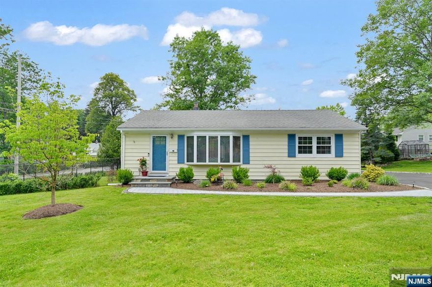 Picture perfect! Move right into this remodeled three bedroom, two bath ranch. Sun filled living room with gleaming hardwood floors welcome you to one-floor living. The custom white, granite and stainless kitchen with breakfast bar opens to the lovely dining room - perfect for entertaining. There is a Primary bedroom suite, two additional bedrooms and main bath to complete the first floor. Downstairs is a large rec room and laundry. Both the kitchen and primary bedroom lead to the oversized deck overlooking the picturesque private rear yard and two-car garage. Don't miss this impeccable home!