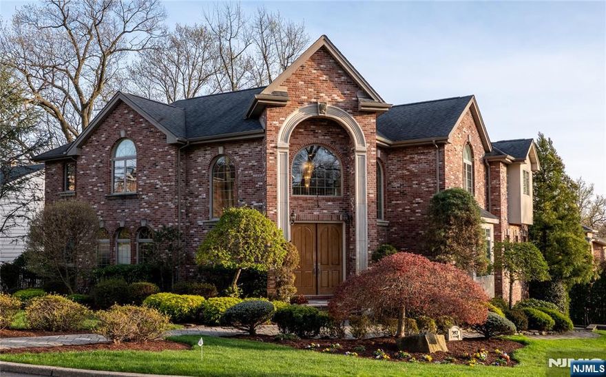 Welcome to this beautiful custom-Built Brick Center Hall Colonial, where elegance, comfort and family friendly living blend seamlessly. Step into the impressive two-story marble foyer with radiant heated floors, leading to a sun-drenched great room with a cozy fireplace and soaring windows that flood the space with natural light. The heart of the home is a gourmet kitchen featuring custom cabinetry, an eat-in area, and direct access to the deck and beautiful fenced backyard â€“ complete with a private jacuzzi oasis. The formal dining room sets the stage for stylish entertaining, while a first-floor office provides a perfect work-from-home space. The main level also includes a private guest suite, a convenient powder room, and a laundry room designed for ease and efficiency. Upstairs, the luxurious primary suite offers a true retreat with a spa-like bathroom, a walk-in closet, and two extra closets for ample storage. Three well-appointed bedroomsâ€”one ensuite and two sharing an adjoining bath â€”offer spacious, comfortable accommodations. The fully finished basement expands your living space with a large recreation area, an additional bedroom with a full bath, and access to a spacious two-car garage. This home is in a prime location just minutes to NYC, top rated restaurants and prestigious schools.