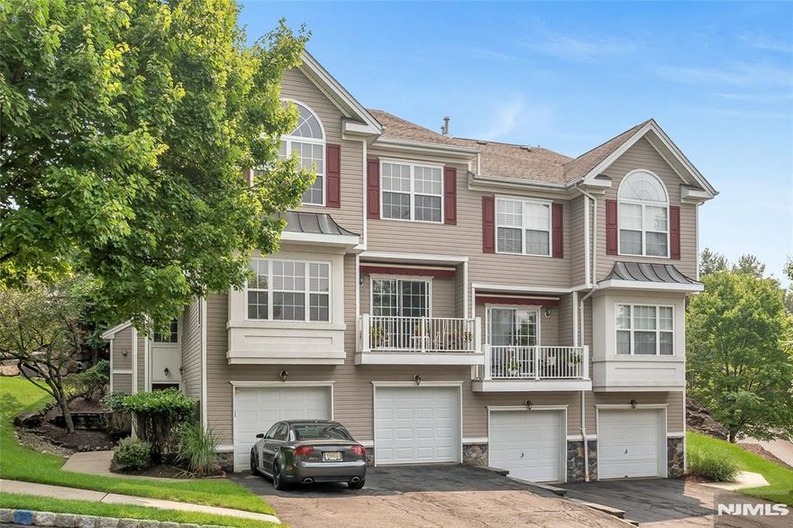 Spectacular 2 Bedroom, 2.5 Bath End-Unit Townhouse in desirable Summit Falls featuring 3 floors of living. Enter in 2-story foyer, with beautiful chandelier. The first level has a family room / den, additional living space, extra niche for desk or office and can also walk out through the attached garage. Upstairs an open plan includes living room with gas burning fireplace, formal dinning room, powder room & kitchen niched out nicely with eat-in area & pantry. Step out from dinning area to private patio. On the third level you will find 2 bedrooms, 2 newly renovated full bathrooms and laundry closet. Master Bedroom features vaulted ceilings, walk in closet and master bathroom. Hard wood floors, new carpet & freshly painted throughout. Summit Falls features scenic falls, gazebo and beautiful in ground pool. Not to Miss!