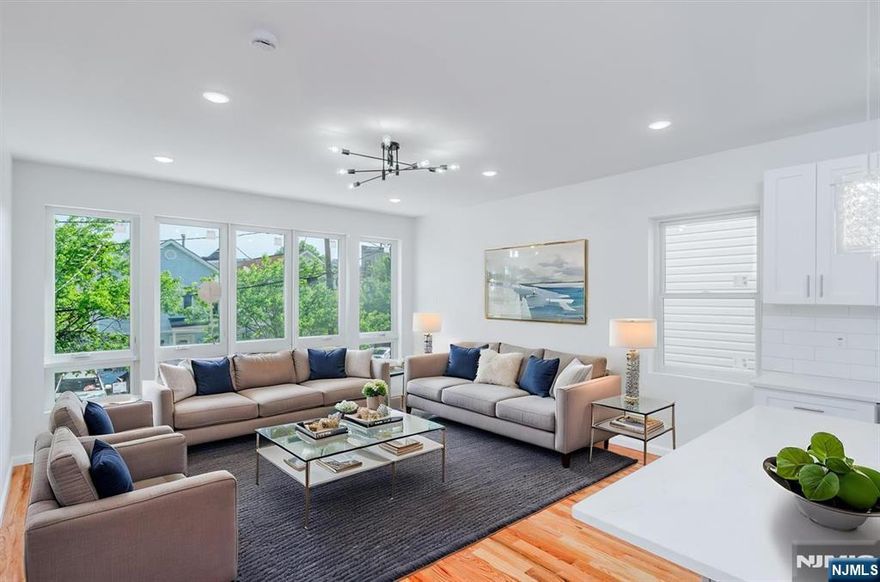 Experience the epitome of luxury living at 85 Myrtle Avenue. Positioned in the booming Greenville area of Jersey City, you are 30 minutes from Lower Manhattan, and proximate to a plethora of the finest dining, arts, and entertainment Jersey City has to offer! The open-concept floor plan showcases the perfect blend of grandeur and contemporary living. This first floor residence features three bedrooms, two and one half bathrooms, and laundry room. The master suite boasts a lavish full bathroom, private balcony, and custom-made walk-in closets, ideal for even the most discerning of buyers. The finished ground level provides an additional half bathroom and an open canvas ready to be transformed into your next family-room, flex-space, or man-cave! Embrace security and privacy with your fenced-in, lush backyard and tandem covered garage space. Relish the next chapter of splendor, and be the new home-owner of 85 Myrtle Avenue, TODAY! *** FIRST TIME HOME BUYER'S QUALIFY FOR SPECIAL FINANCING INCLUDING 5.5% INTEREST RATE, NO PMI, AND LENDER FEE WAIVED WITH PREFERED LENDER. INQUIRE FOR MORE INFO.***