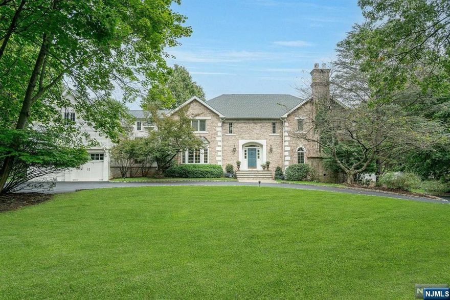 English Country charm meets Tuscan elegance in this 4-bed, 4.5-bath estate. Nestled on 1.45 acres a circular drive leads to this private oasis w/ gunite salt water pool, manicured gardens, bocce court, koi pond & several blue stone patios. Greeted by a two-story entry that flows into beautiful living spaces like a library w/ fpl and a sun drenched great room w cathedral ceilings and French doors that open to patio perfect for entertaining. The EIK has high end appliances and an island w/seating. The DR, w/large bay windows, provides an elegant setting. The 1st flr also incl. a LR w/fpl, built-in bar & outdoor access, office w/full bath, ldry/mdrm and PR. Upstairs there are 4 bedrooms including a primary suite w spa-like bath w/ marble vanity, shower & jacuzzi, secondary en suite w lndry perfect for extended family living in a private wing accessible via a back staircase or elevator. Home also incl. a wine room, gym & 5 car garage! Don't miss this special home a decorator's dream!