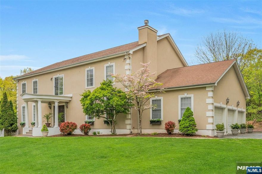 Experience a rare blend of privacy, space, and refined living in this expansive custom-built 6-bedroom, 5.5-bath sanctuary tucked away on a quiet cul-de-sac in sought-after Upper Montclair - just minutes from the NYC direct train. Built in 1996, this exceptional home is designed for both everyday comfort and effortless entertaining. The main level features a spacious living room with fireplace, an elegant dining and family room combination, and a gourmet kitchen with a separate prep kitchen - perfect for hosting. Just beyond, a sun-filled sunroom offers a peaceful retreat for morning coffee or relaxed afternoons, all overlooking the home's serene surroundings. Upstairs, four generously sized bedrooms each feature their own en suite bath, creating a sense of luxury and privacy for everyone. A bright, open sitting area/home office at the top of the stairs adds flexibility for modern living. The ground level introduces a standout feature: a 2-bedroom living space with its own private entrance. Complete with full kitchen, living room, dining area, and full bath, this separate dwelling offers exceptional privacy. Outdoors, the property continues to impress with an in-ground heated pool and an expansive 3-car garage that adds both convenience and distinction. Set within the highly regarded Montclair School District and just minutes from Montclair's vibrant downtown, this home offers the rare combination of complete seclusion and effortless access to all Montclair has to offer!