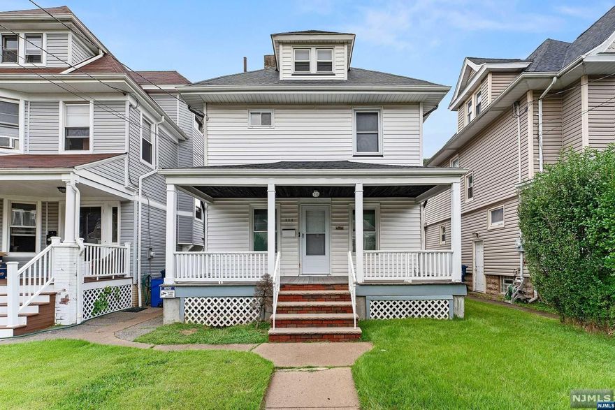 Discover this charming Colonial, minutes from NYC. The inviting Lemonade Porch leads to a cozy Living Room with a wood-beamed ceiling and faux stone wall. The Formal Dining Room features a stained-glass window and natural wood accents. The updated Modern Eat-In Kitchen (MEIK) boasts stainless steel appliances and opens to a spacious backyard ideal for entertaining. Upstairs are two bedrooms, including one with three closets, plus a full bath. The walk-up attic offers a versatile bonus room. The lower level includes a third bedroom, a bonus room, and a half bath. Enjoy the large backyard with a deck and patio. Additional amenities include a two-car garage and central air. Make this charming home yours!