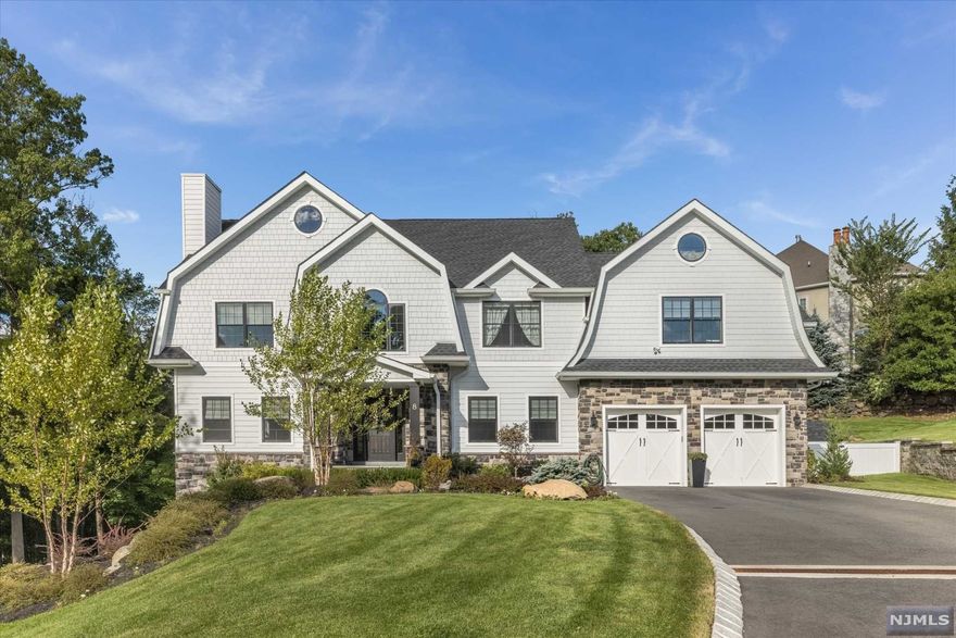 Your Dream Home has Arrived! Located on a Quiet Cul-de-sac, this Fabulous 5BR, 3.5 Bth Colonial Offers Hardie Board Siding & Approximately 5400 sq ft (including Fin Bsmt) of Luxury Living Space! Home Features 2 Story EF, Sun-filled Liv Rm w/Brick Fpl, Stunning Eat-in-kit w/Top of the Line Appliances, Double Center Islands, Full Pantry, Sep Din Area & Sliders to Yard. Formal Din Rm. 1st Flr Powder Rm & Laundry Rm. Gracious Staircase Leads to 2nd Flr MBR w/Custom Paint, Tray Ceiling, Huge Walk-in-closet w/Wardrobe Center Island & Luxurious Mba. Full Fin Wlk-out Bsmt, Great for In-Law Suite, Features FR w/Sliders to Patio, Full Summer Kit, Rec Rm, Exercise Rm, BR & Fbth. Gleaming Hwd Flrs, Pella Windows, Recessed Lighting, Custom Paint & Trim Through-out. Private Yard w/2 Paver Patios + So Much More to Enjoy!
