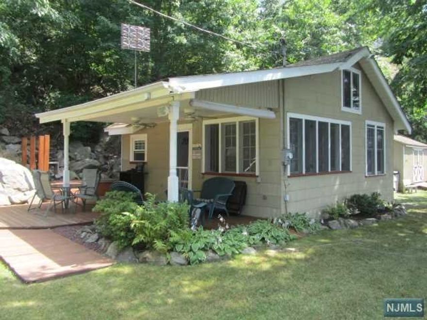LOVELY THREE SEASON COTTAGE LOCATED ON GREENWOOD LAKE WITH 126 FEET OF PRIVATE LAKE FRONTAGE, PRIVATE SEATING AREA, DOCK, AREA TO LAUNCH YOUR BOAT OR JET SKIS,LARGE STORAGE/TOOL SHED,GREAT FOR ALL TYPES OF WATERS SPORTS, LAKE HAS MARINAS AND PLENTY OF RESTURANTS.