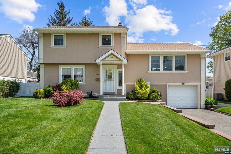 Immaculately updated and ideal for commuters! Situated on a cul-de-sac in the desirable Montclair Heights section, this pristine split-level offers a tranquil neighborhood setting while being mere minutes from top Bergen County shopping, Rt. 3, and Allwood Park & Ride. A meticulously landscaped exterior brings you to a bright & spacious interior with gleaming hardwood floors, 4 bedrooms, 2 renovated baths, and an open concept designed for entertaining & everyday living. Main level features a living room that flows into a modern eat-in kitchen equipped with stainless steel appliances & a breakfast bar/island, extending naturally into the dining area with sliding doors to an impressive deck and patio overlooking the large fenced backyard. Three 2nd level bedrooms, and a ground level featuring a family room, bedroom, and full bathroom, making for a perfect in-law suite or home office setup. Finished mudroom in basement with access to attached garage. Your search in Clifton ends here!