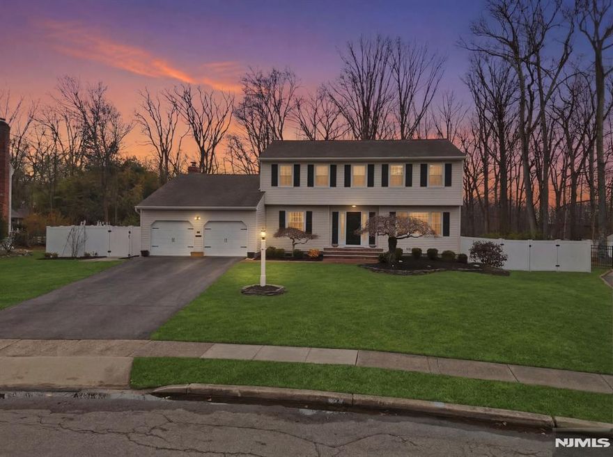 Well-maintained Colonial located in the desirable Packanack Lake community, offering a comfortable layout and great space both inside and out. The first floor features a bright living room, formal dining room and a large eat-in kitchen with granite countertops, center island, and sliders leading to the deck. Just off the kitchen is a spacious family room with a gas fireplace and a second set of sliding doors that open to the backyard. The backyard offers plenty of space for entertaining or relaxing and includes a wood-burning fire pit. Upstairs you'll find a large primary bedroom with a walk-in closet and a full bath featuring a soaking tub, double vanity, and separate shower. The second bedroom includes its own full bath, and a third bedroom completes the upper level. The finished basement provides flexible space for a playroom, home office, gym, or recreation area, along with a laundry room and a large storage room. Additional features include two newer HVAC systems, generator hookup, ring camera system monitoring entire property, Lutron smart switches throughout the house, and Cat6 Ethernet wiring throughout the home for improved WiFi coverage. Conveniently located close to Packanack Lake amenities, shopping, major highways, and NYC transportation.