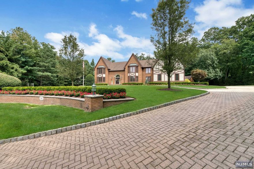 Magnificent Tudor Colonial of 6300 sq ft is set on a flat ,manicured acre at end of cul-de sac in prestigious High Woods Gate of Urban Farms. This exceptional home is a rare synthesis of architectural sophistication & classic elegance, all with a wonderfully comfortable ambience. Its curb appeal is accented by stunning details where natural light floods the home on every level. The fantastic two story great room w/fireplace/ wet bar & walls of windows overlooks the meticulously groomed and private back yard which includes heated gunite pool, bluestone patios, pool house and Sonos sound system with 8 speakers. 1st fl Grand sized dining room, custom Salerno kitchen w/ fireplace, center island & beautifully trimmed breakfast rm . The 2nd floor features a library, 4 bedrooms & 3 baths including a sumptuous master suite. The almost 3,000 sq. ft finished basement is complete w/family room, wet bar, media room , gym & bath. Natural gas generator offers peace of mind!