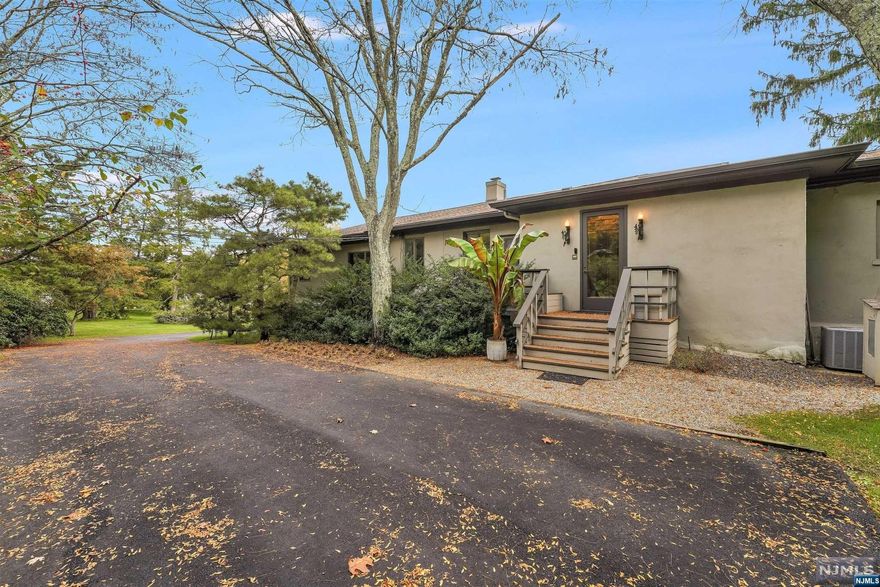 Mid-century modern luxurious marvel on 6 acres of park-like property available for the first time in more than 40 years is an Entertainer's Paradise! Quintessential floor to ceiling windows and doors harmonize the open concept layout inside with the professionally-designed property outside, complete with a pond, mature plantings, an inground pool, wrap around deck, barn, and gazebo. Each bedroom has an en-suite bathroom. Beautiful wooden detail throughout, including a custom imported staircase, as well as in the Library, common areas, and the Primary bedroom. In-law suite PLUS an Accessory Dwelling Unit, both with kitchens perfect for an extended family. Enough acreage for horses to roam freely. Potential subdivision- buyer to perform own due diligence.