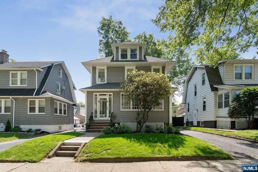This 3 bedroom 1.5 baths is a "MUST SEE" that has beautiful hardwood floors throughout, a spacious dining room, sun-filled enclosed porch and a finished walk-up attic that has two bonus rooms. This home is located on a very quiet and tree-lined block.