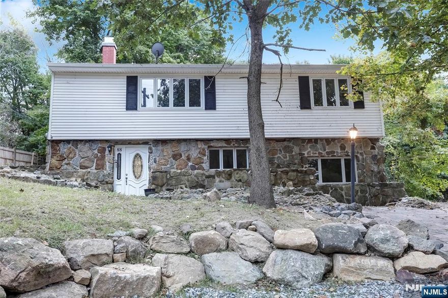 Lake Life Awaits! This renovated raised ranch nestled in the desirable Nolan's Point community offers picturesque lake views and is mere steps from New Jerseyâ€™s largest lake. Imagine spending your days boating, fishing, or indulging in lakeside dining â€“ all just moments from your doorstep! The open-concept main level features a spacious eat-in kitchen, perfect for gathering and entertaining, a comfortable living room filled with natural light, two generously sized bedrooms, and a full bath. The ground level boasts a cozy family room with a wood-burning fireplace, an additional bedroom, a convenient laundry area, and a full bath. Step outside to your private backyard oasis, complete with charming stone walls and a delightful stone patio â€“ ideal for hosting summer barbecues or simply relaxing in the fresh air. And when you're ready to explore the area, you're just steps away from marinas, the Lake Hopatcong Golf Club, and renowned dining establishments like The Jefferson House and The Windlass. Don't miss out on this incredible opportunity to embrace the lake lifestyle!