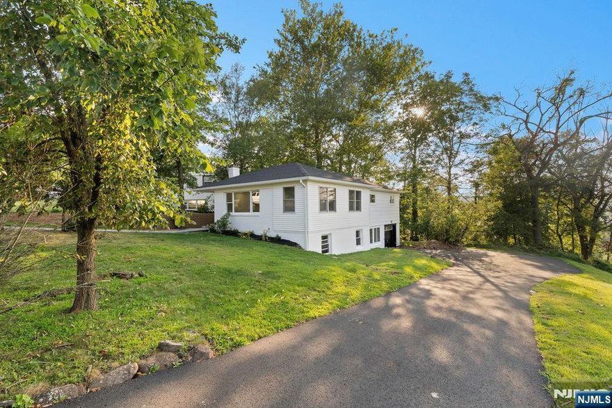 Stunningly updated ranch nestled in one of West Orangeâ€™s most sought-after neighborhoods. This home boasts a brand-new roof, gleaming hardwood floors, a custom designed kitchen, and elegantly renovated bathrooms. Enhanced moldings and fresh interior and exterior paint add to its appeal, while all new light fixtures and interior doors bring a modern, cohesive touch. Step outside to beautifully paved walkways, a brand-new driveway, and a cozy pavered backyard ideal for outdoor living, entertaining, or simply relaxing in style.